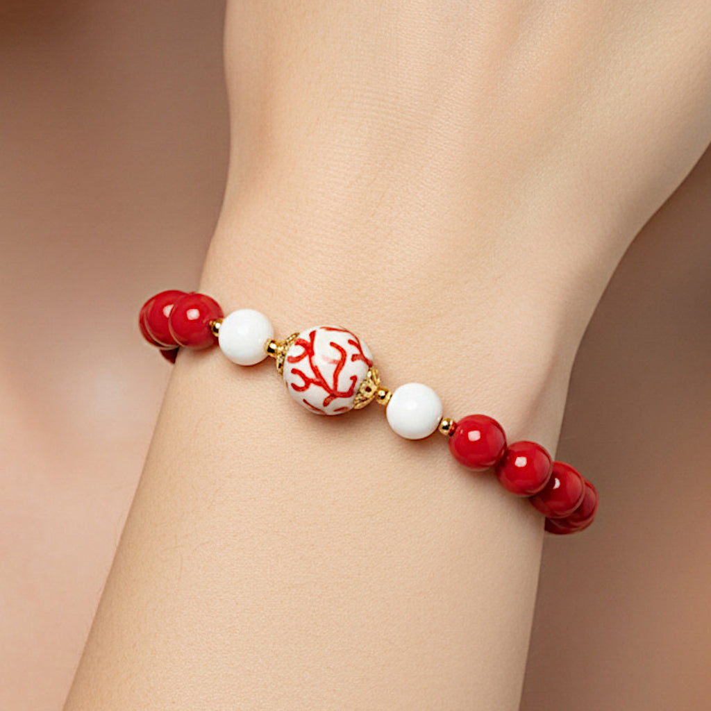 Bracciale Menfi in pasta di corallo e perla in ceramica di Caltagirone